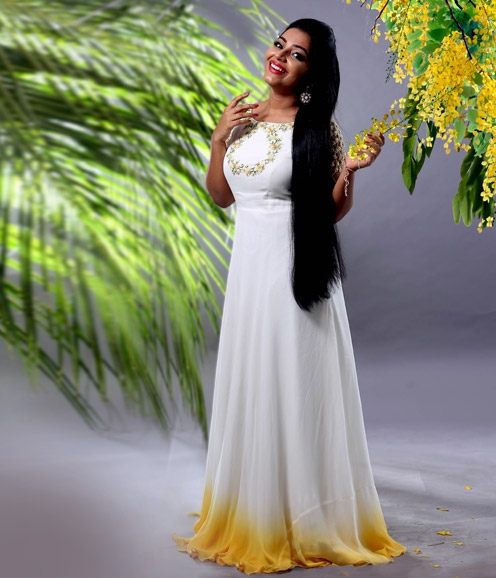 Rajisha Vijayan in shaded yellow and white gown
